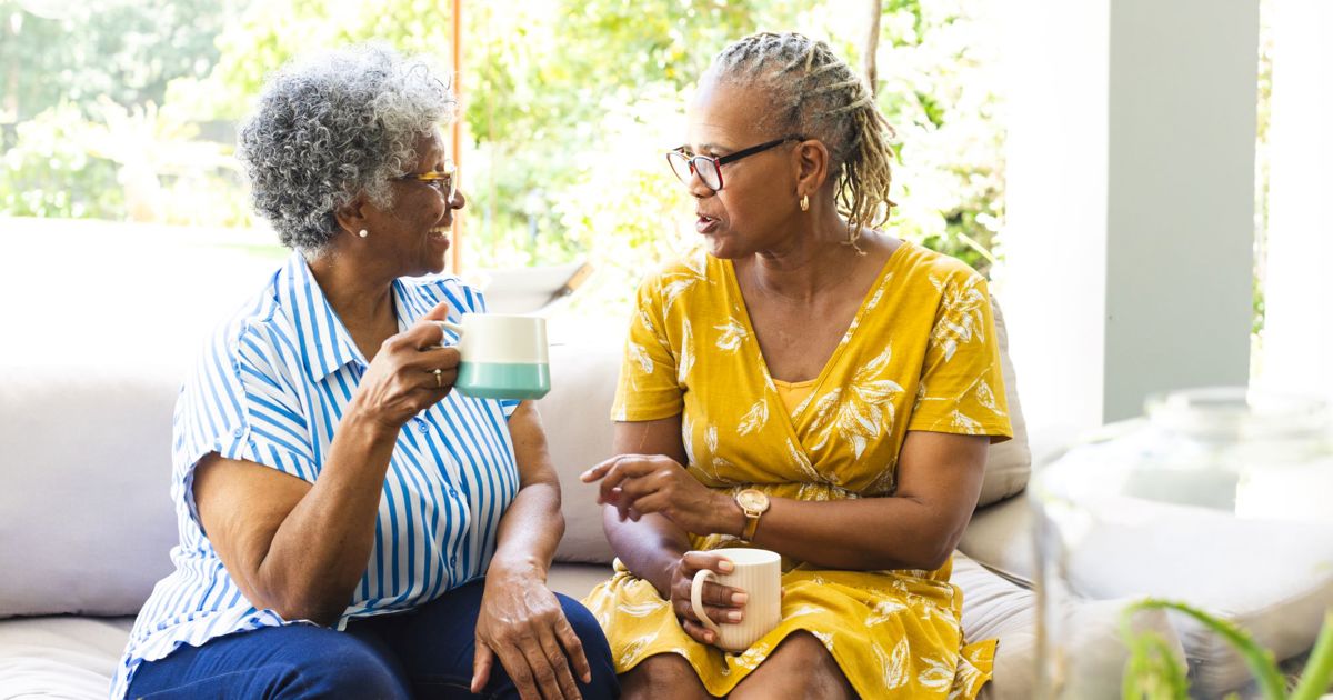 Elderly ladies chatting having a coffee stock
